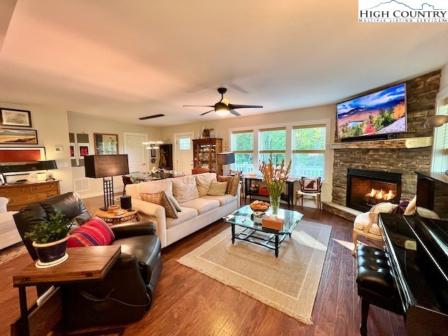 366 Russelton Road Boone, NC 28607 - Photo 5 of 29 a living room with furniture fireplace and a large window