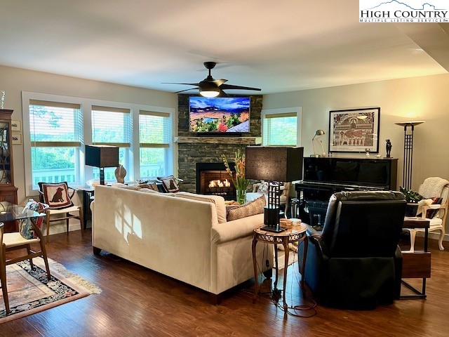 366 Russelton Road Boone, NC 28607 - Photo 6 of 29 a living room with furniture a flat screen tv and a fireplace