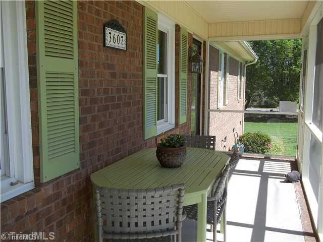 3607 Fieldview Road Pleasant Garden, NC 27313 - Photo 3 of 13 Enclosed Porch. Enjoy morning coffee or meals on this generous 22 x6 screened porch