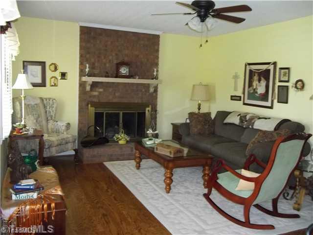 3607 Fieldview Road Pleasant Garden, NC 27313 - Photo 7 of 13 Living Room. Beautiful hardwood floors and wood burning fireplace