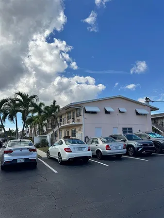 a view of a cars park in front of house