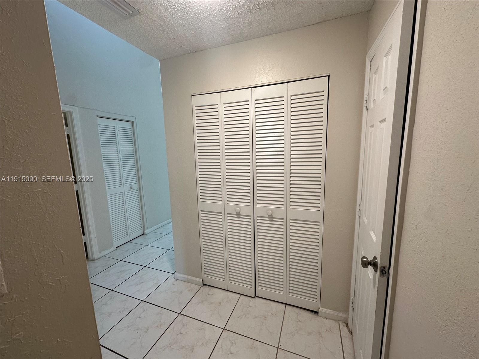 9336 Ketay Circle Boca Raton, FL 33428 - Photo 35 of 48 an empty room with windows
