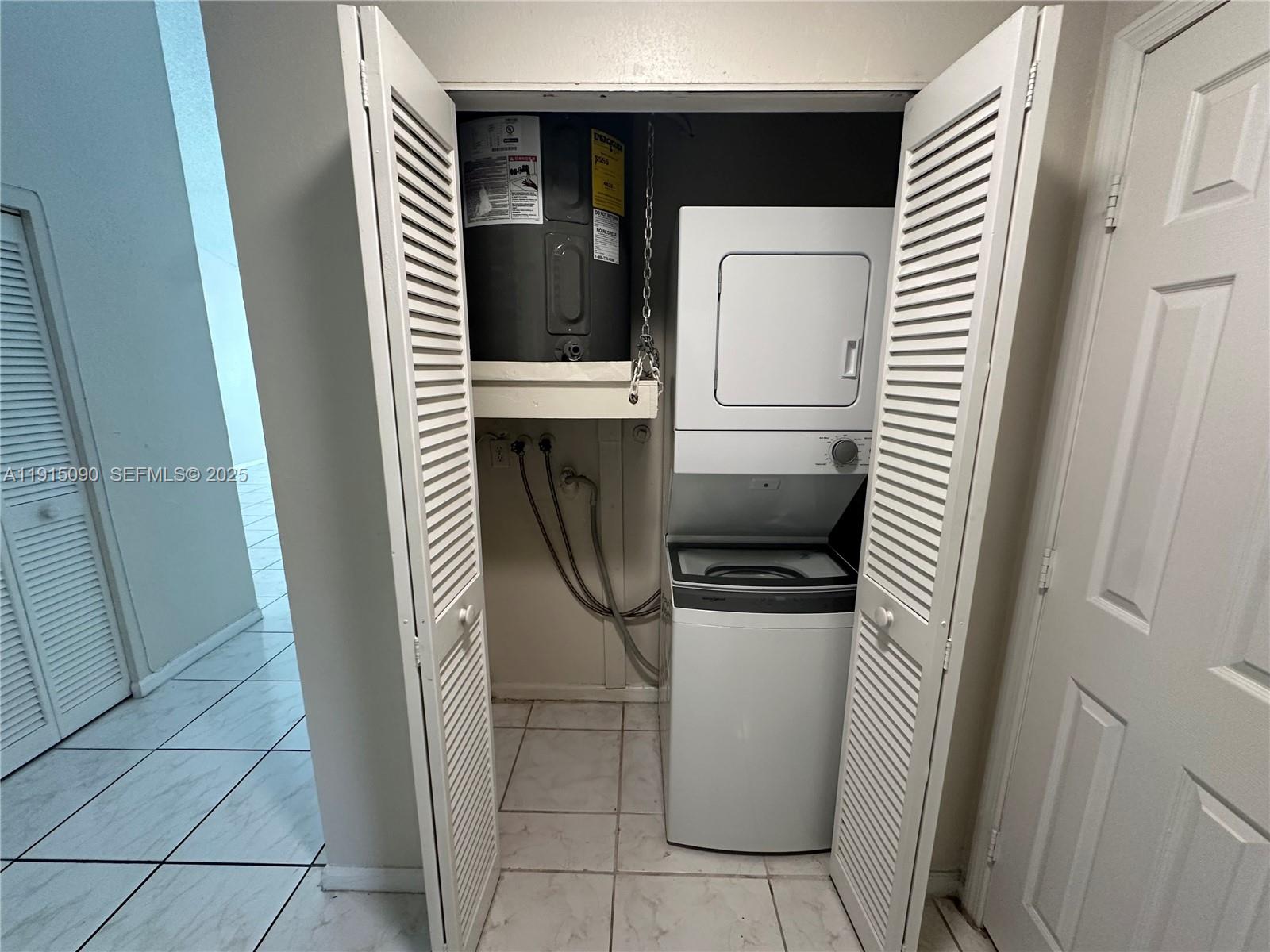 9336 Ketay Circle Boca Raton, FL 33428 - Photo 36 of 48 a utility room with dryer and washer