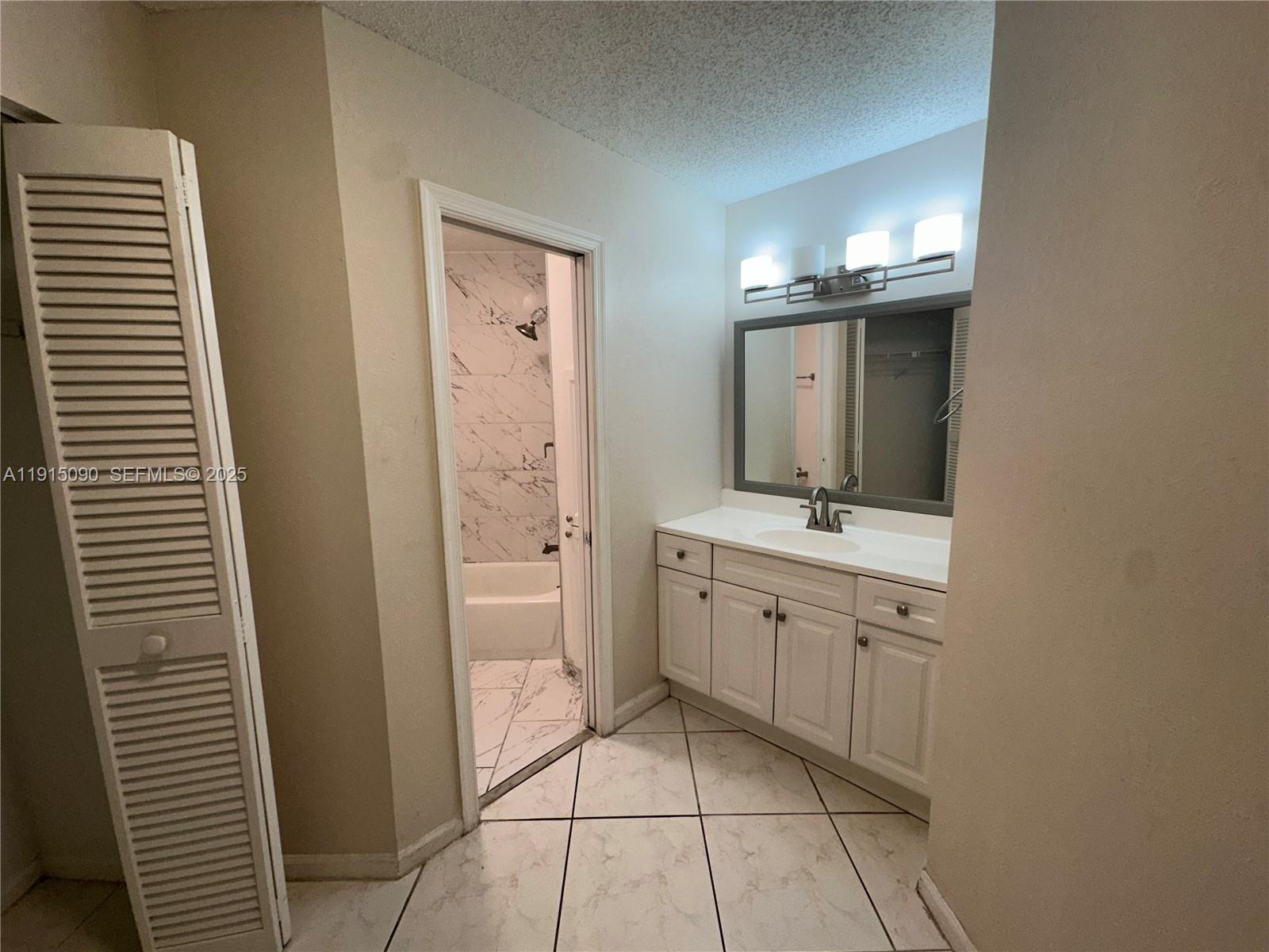 9336 Ketay Circle Boca Raton, FL 33428 - Photo 44 of 48 a bathroom with a double vanity sink a toilet and a mirror