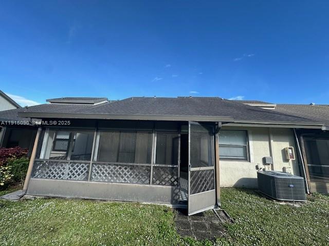 9336 Ketay Circle Boca Raton, FL 33428 - Photo 9 of 48 a front view of a house with a yard
