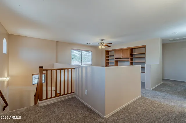 a view of a livingroom with furniture and windows