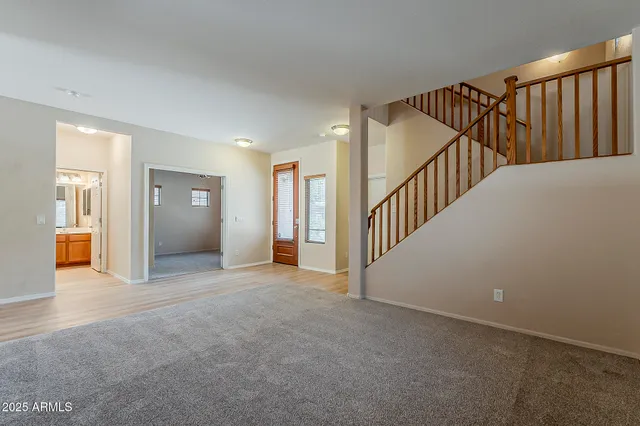 a view of an empty room with stairs