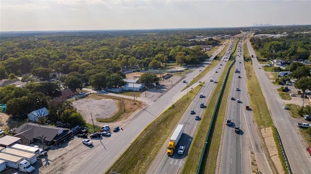 an aerial view of house with yard