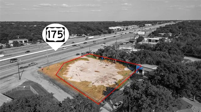 a view of a house with a yard and garage