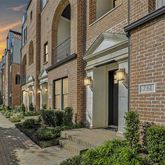 a view of a building with potted plants
