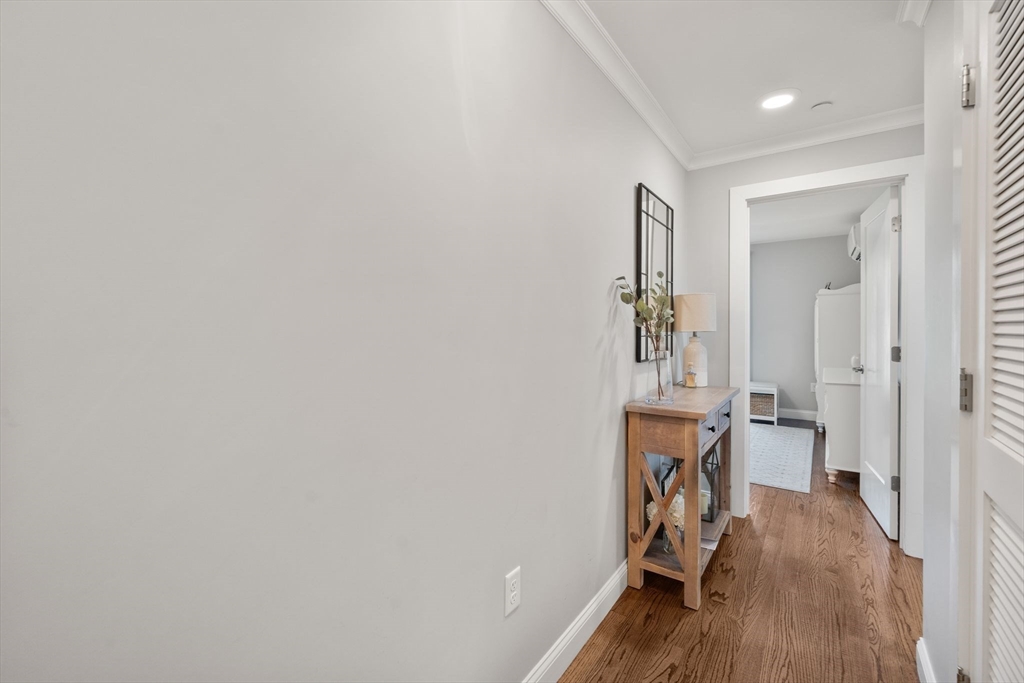 1789 Centre Street, Unit 401 Boston, MA 02132 - Photo 11 of 30 an entryway and livingroom with furniture