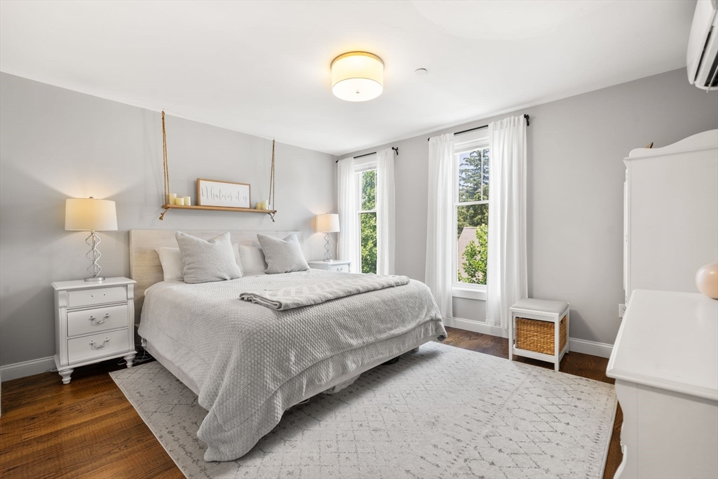 1789 Centre Street, Unit 401 Boston, MA 02132 - Photo 12 of 30 a bedroom with a bed and a window