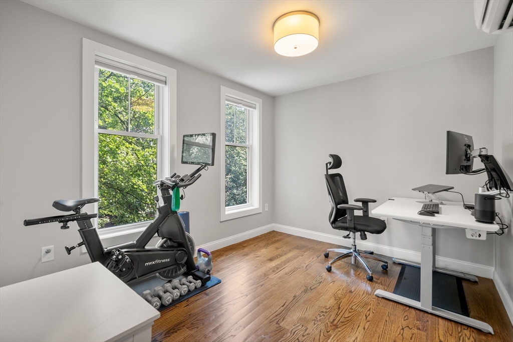 1789 Centre Street, Unit 401 Boston, MA 02132 - Photo 17 of 30 a view of a workspace with gym equipment