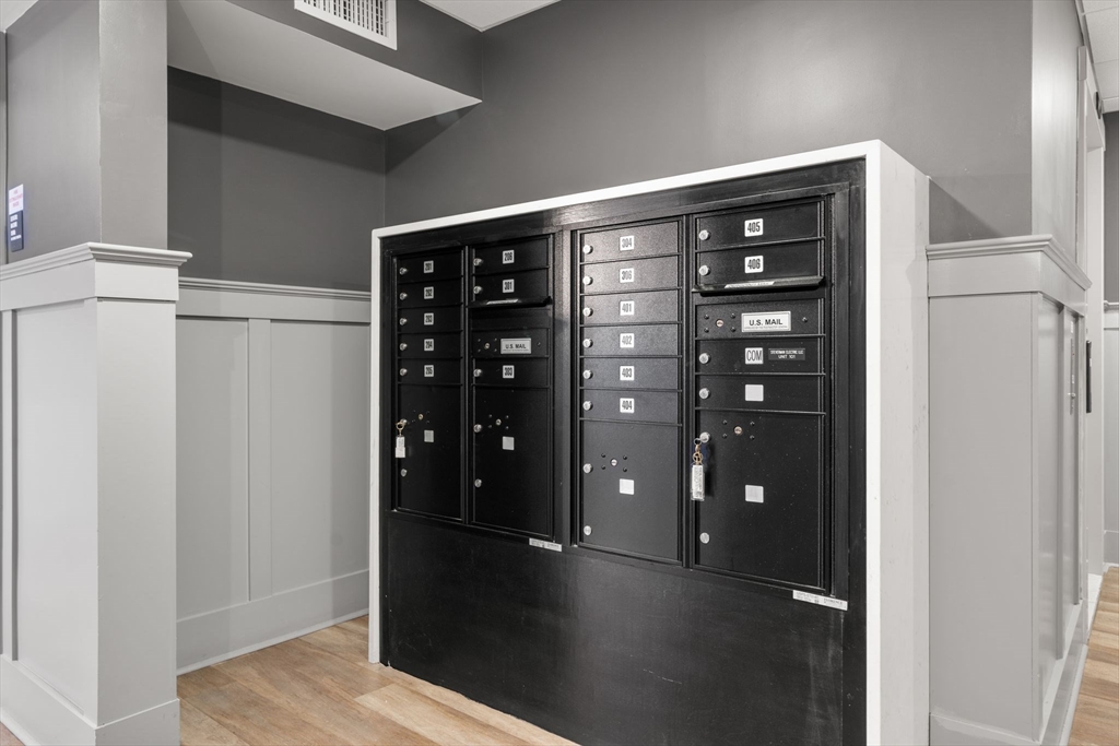 1789 Centre Street, Unit 401 Boston, MA 02132 - Photo 25 of 30 a view of walk in closet with empty racks