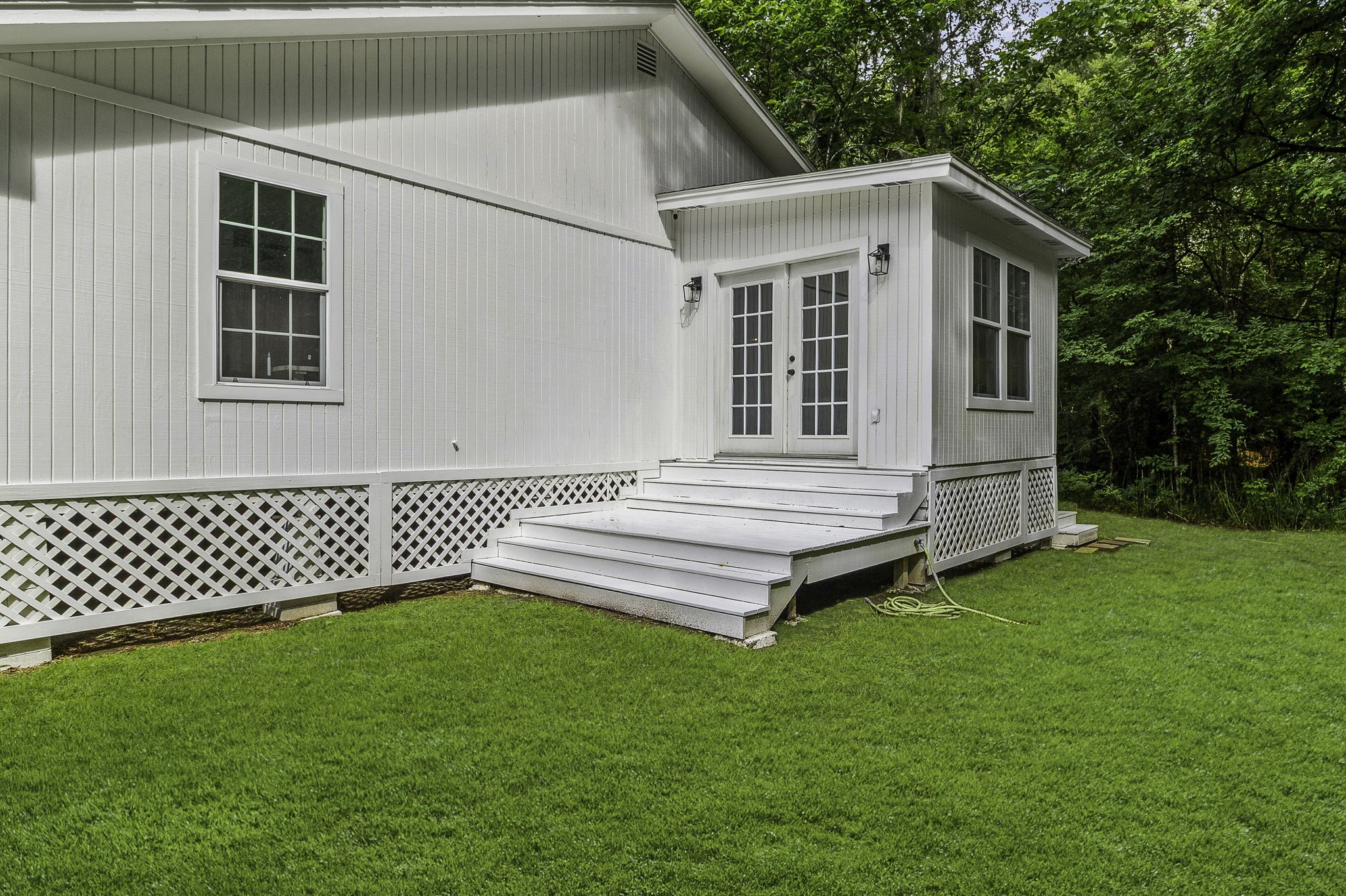 600 Wilderness Road Point Blank, TX 77364 - Photo 19 of 28 Outdoor entertaining area outside of the sunroom is equipped with dedicated gas line for outdoor grill.