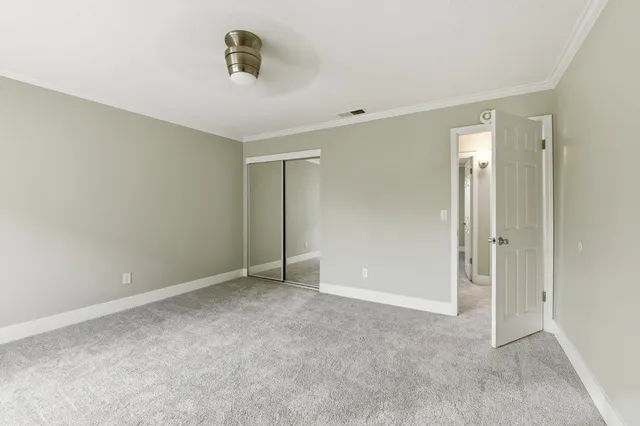 a bathroom with a sink mirror and toilet