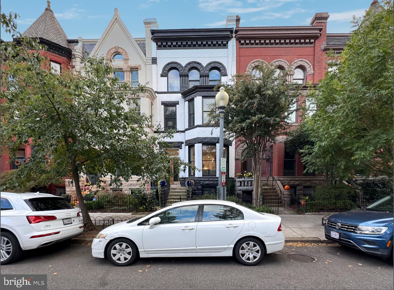 a view of a car parked in front of a house