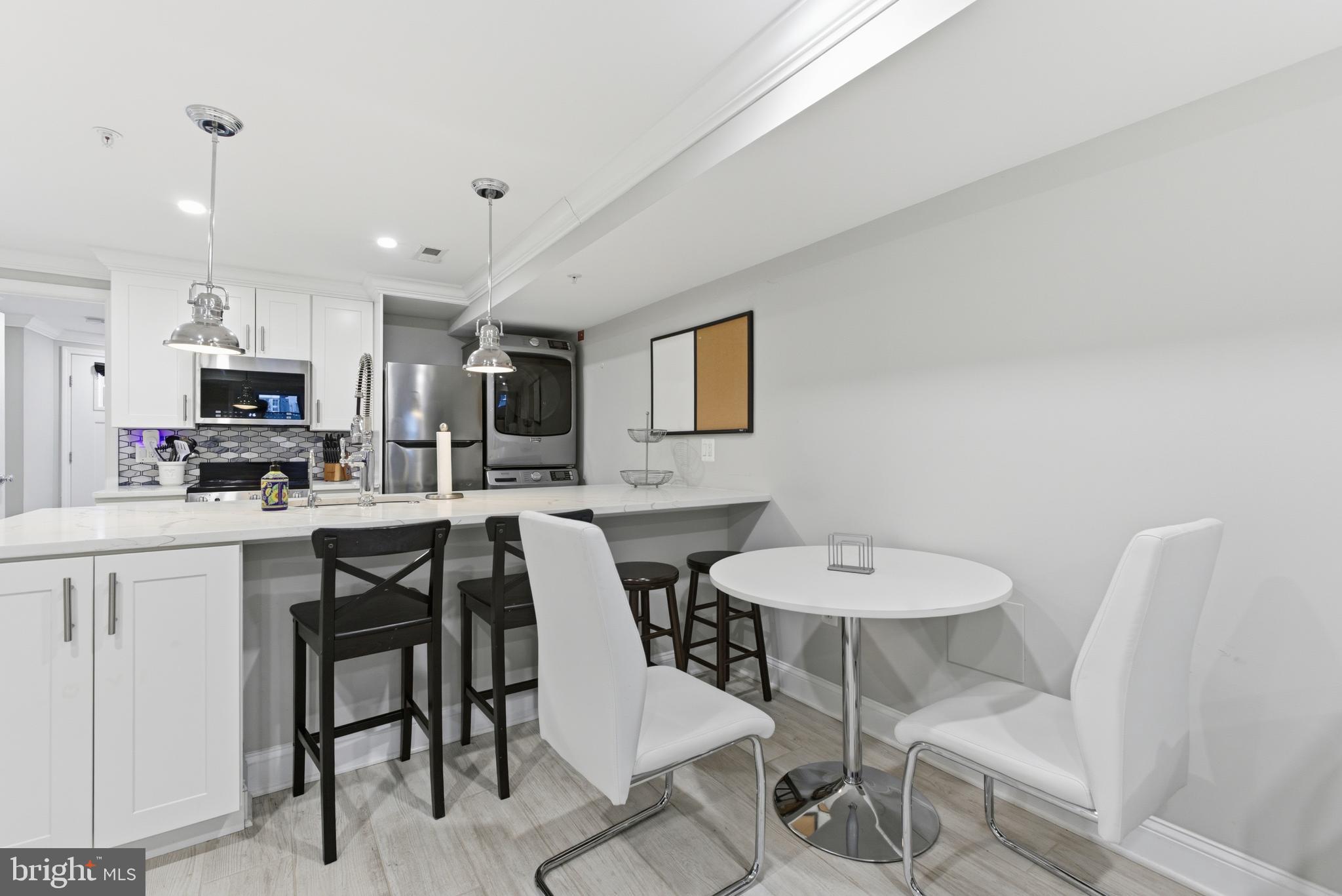 1748 S Street Northwest, Unit 2 Washington, DC 20009 - Photo 13 of 33 a view of a dining room with furniture and wooden floor