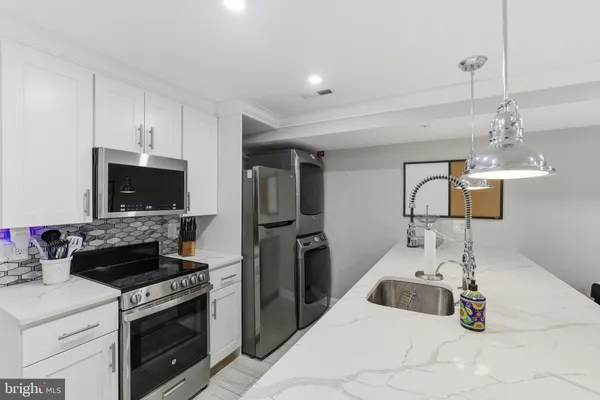a kitchen with a stove and a sink