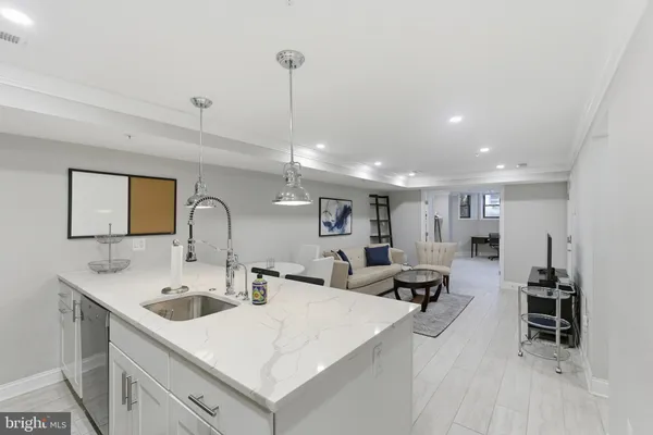 a large kitchen with a large counter top appliances and furniture
