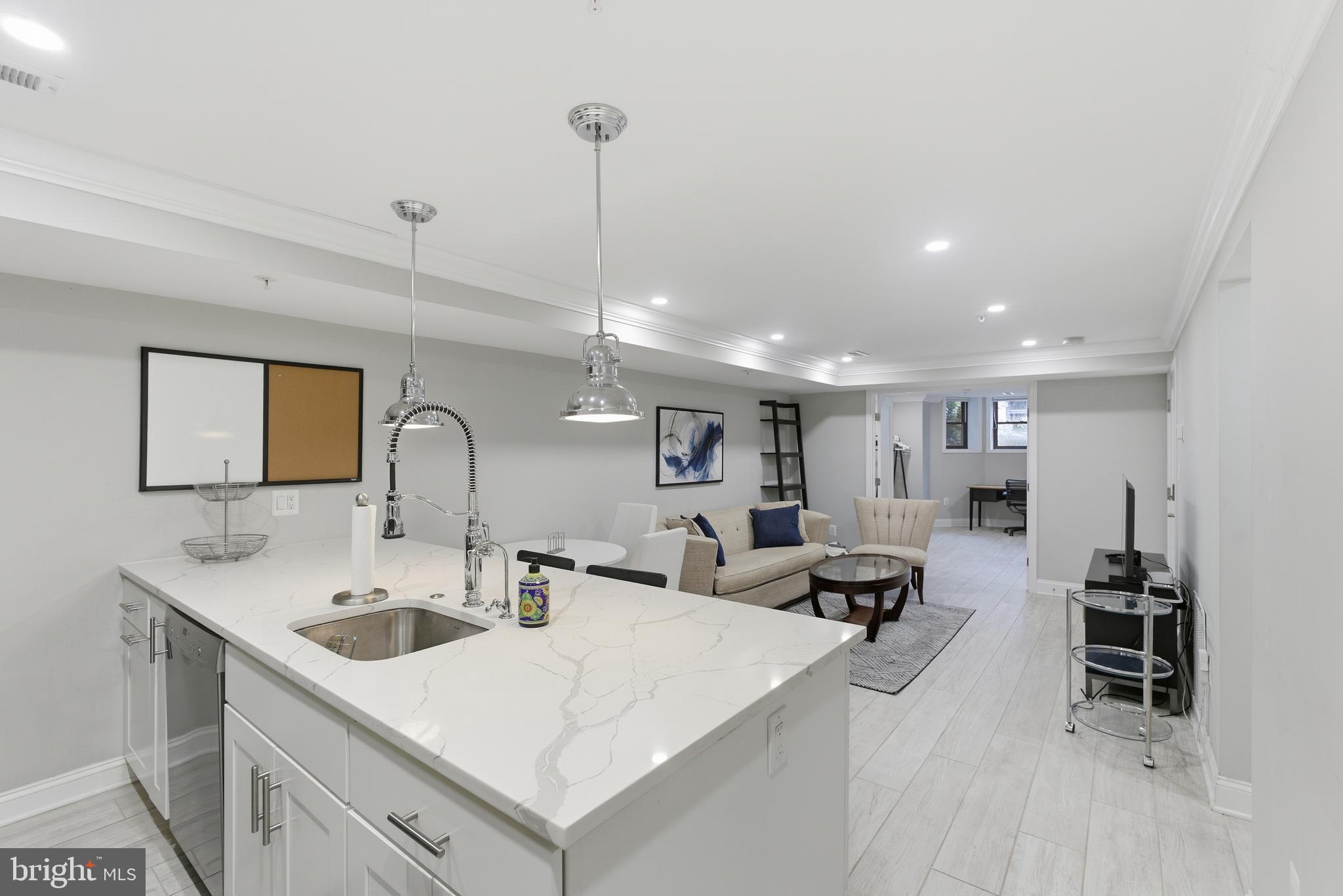 1748 S Street Northwest, Unit 2 Washington, DC 20009 - Photo 18 of 33 a large kitchen with a large counter top appliances and furniture