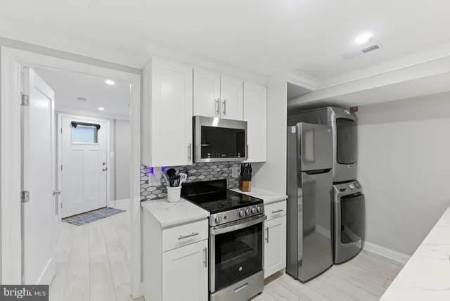 a kitchen with a stove and a refrigerator
