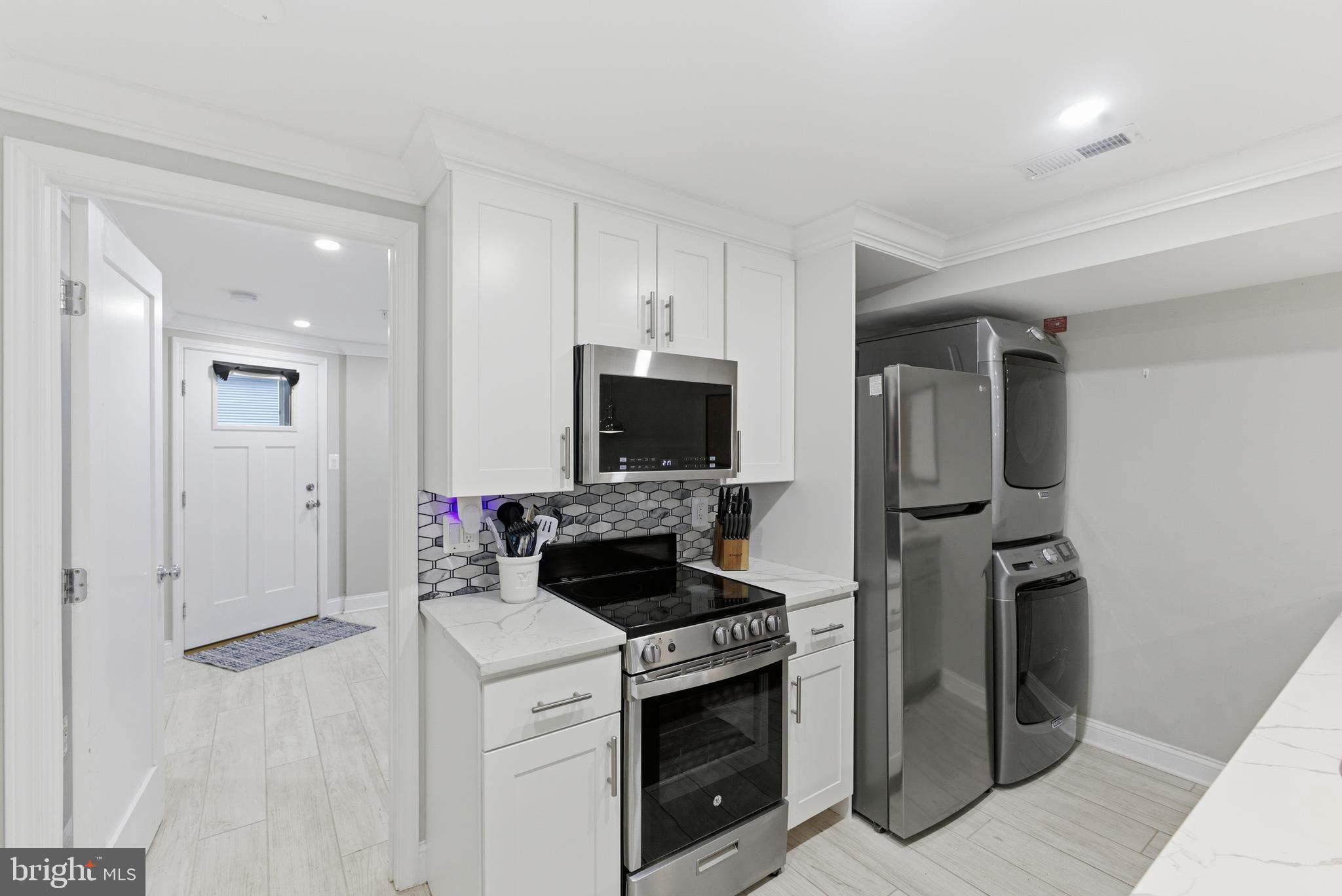 1748 S Street Northwest, Unit 2 Washington, DC 20009 - Photo 19 of 33 a kitchen with a stove and a refrigerator