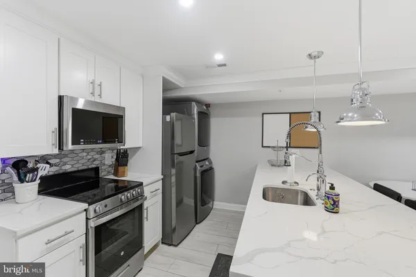 a kitchen with a stove and a sink