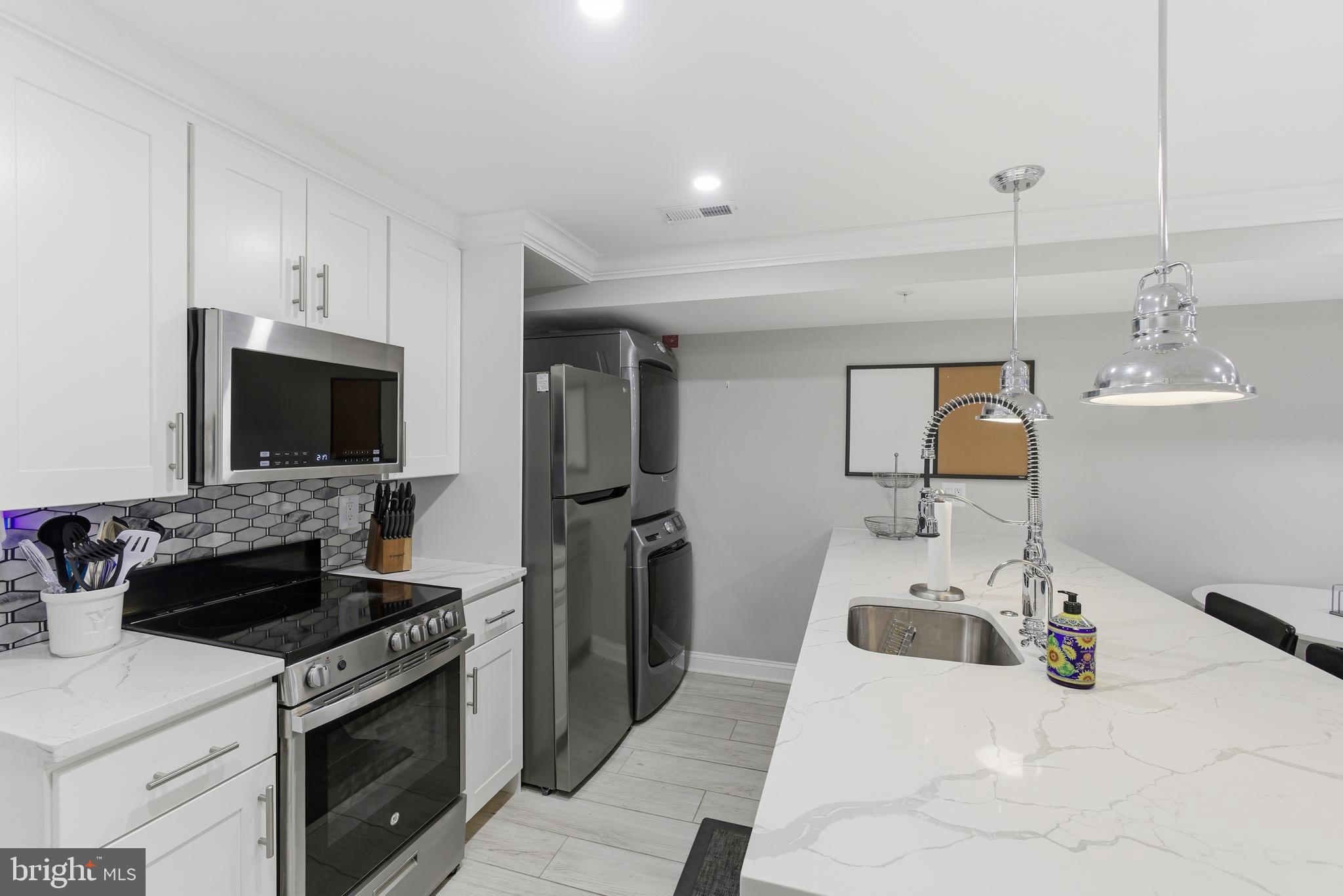 1748 S Street Northwest, Unit 2 Washington, DC 20009 - Photo 20 of 33 a kitchen with a stove and a sink