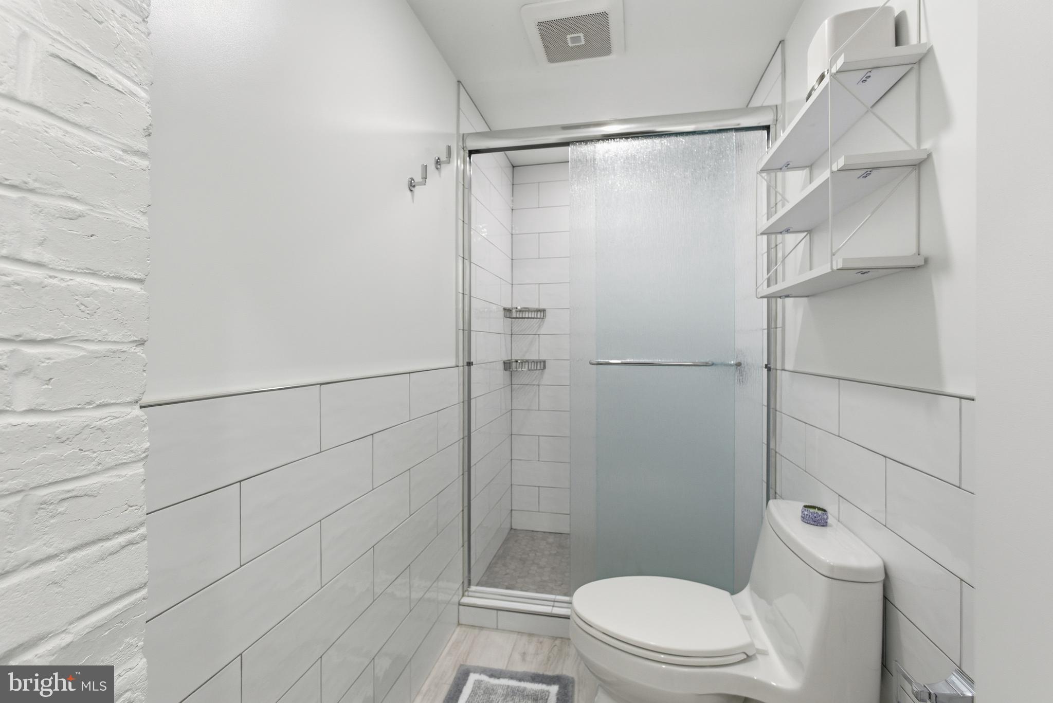 1748 S Street Northwest, Unit 2 Washington, DC 20009 - Photo 24 of 33 a bathroom with a toilet and shower