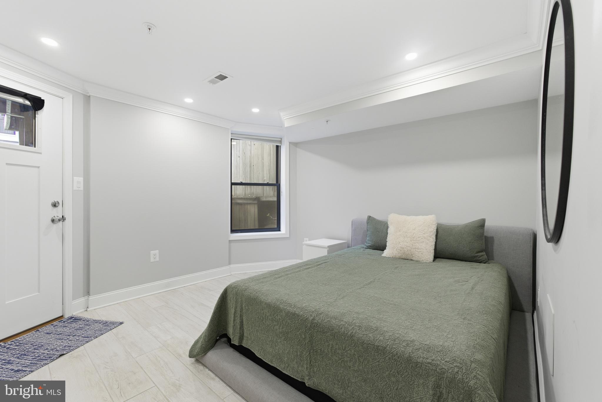 1748 S Street Northwest, Unit 2 Washington, DC 20009 - Photo 29 of 33 a bedroom with a large bed and a ceiling fan