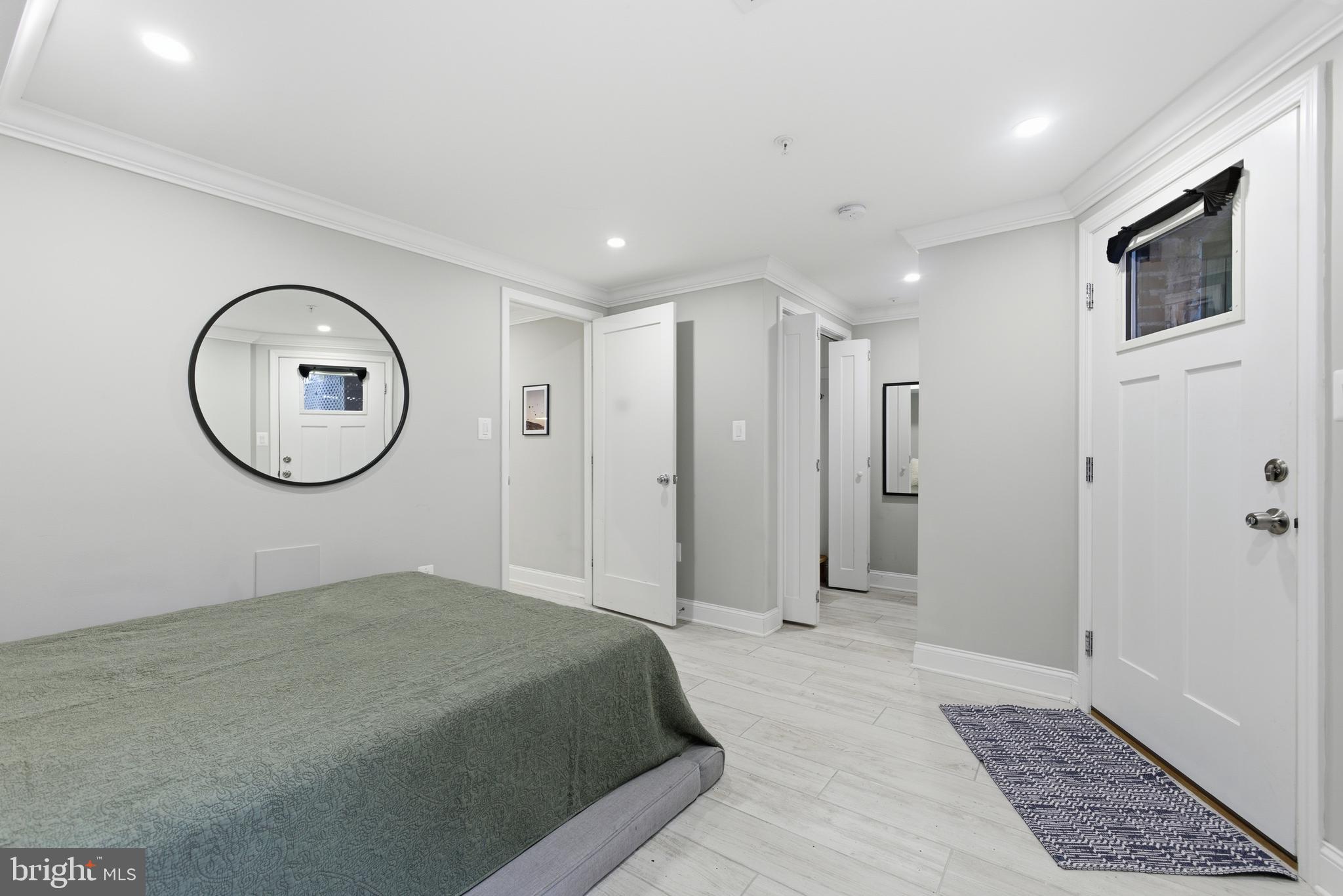 1748 S Street Northwest, Unit 2 Washington, DC 20009 - Photo 33 of 33 a view of a room with wooden floor and white walls