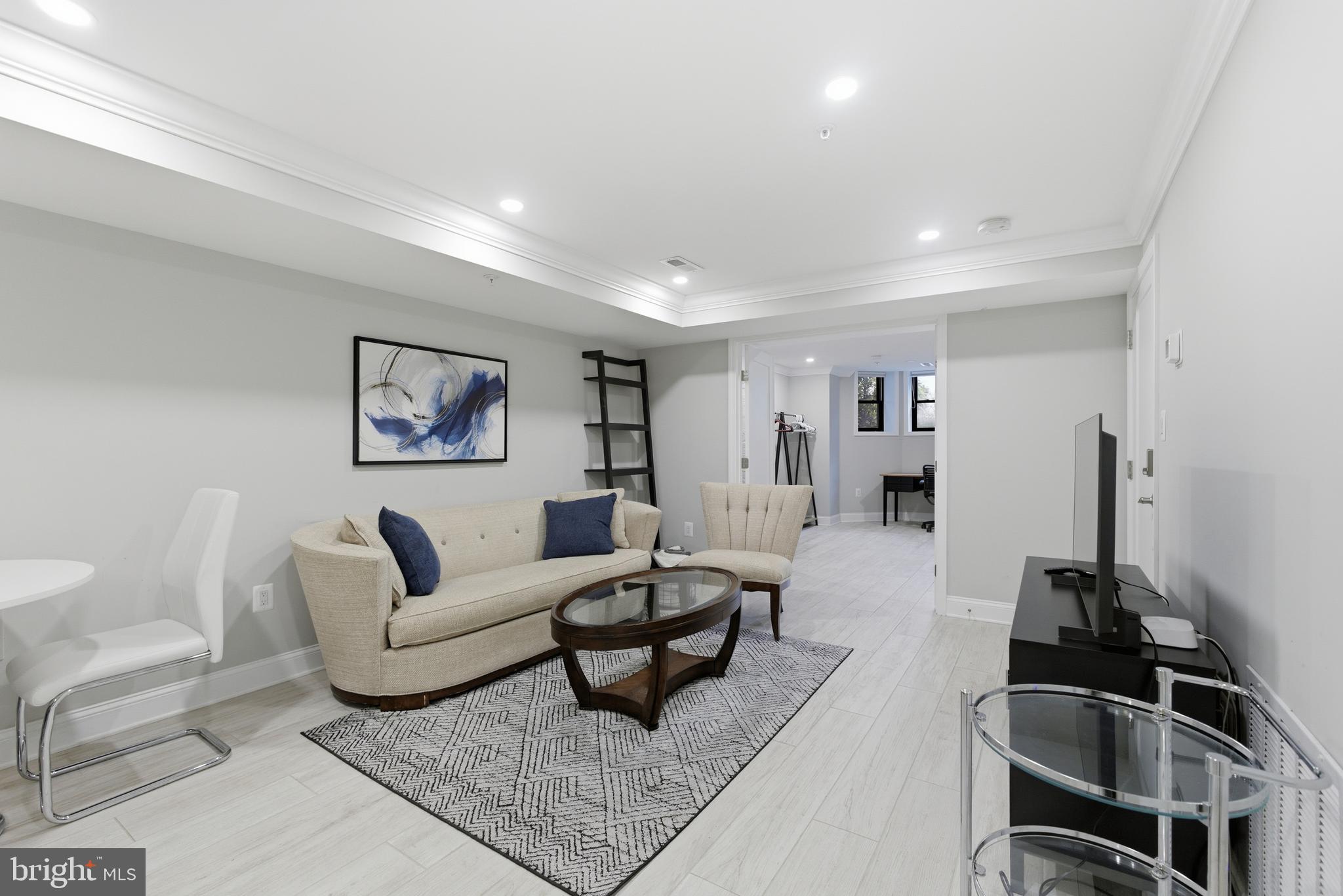 1748 S Street Northwest, Unit 2 Washington, DC 20009 - Photo 4 of 33 a living room with furniture and a rug