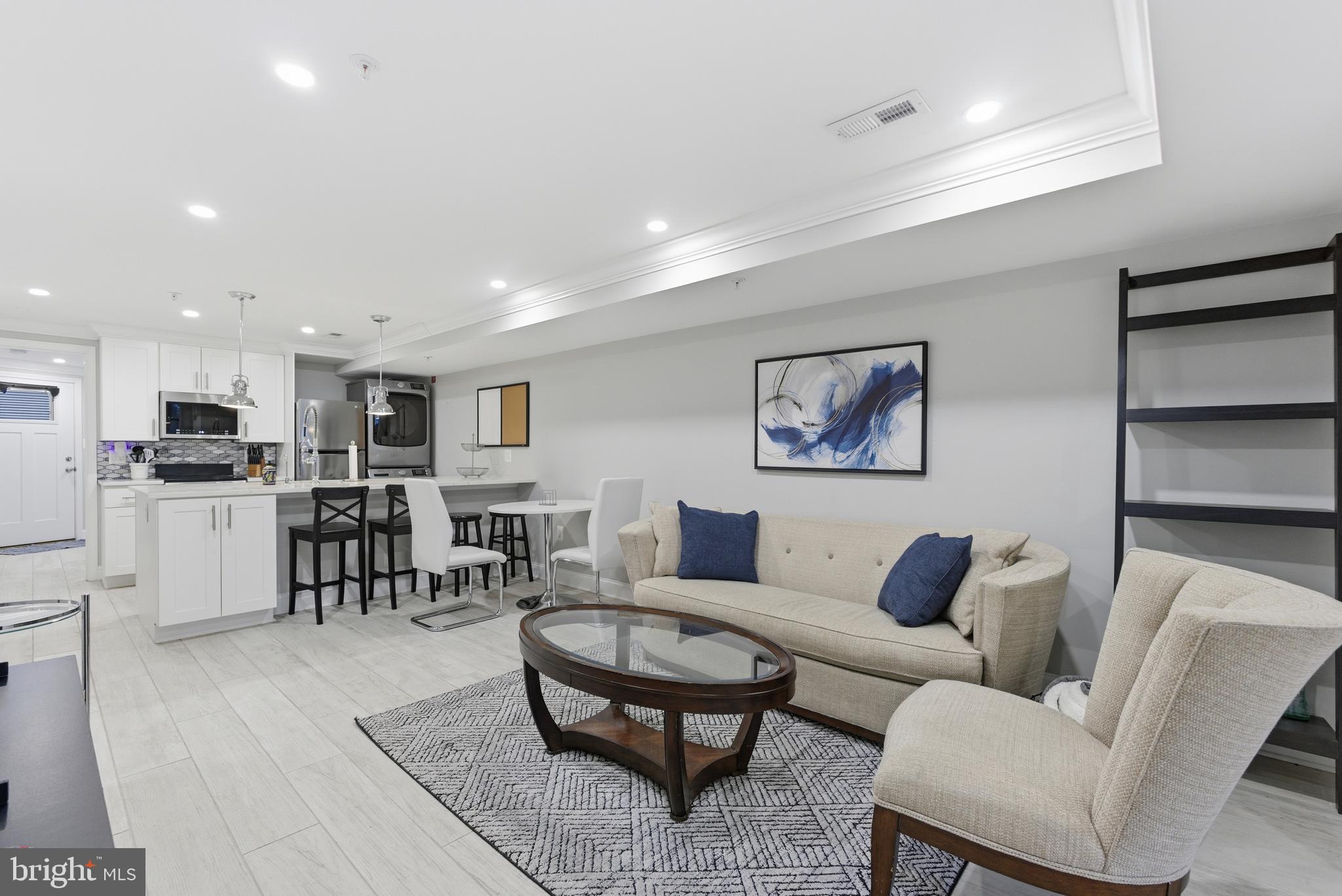 1748 S Street Northwest, Unit 2 Washington, DC 20009 - Photo 5 of 33 a living room with furniture kitchen view and a dining table