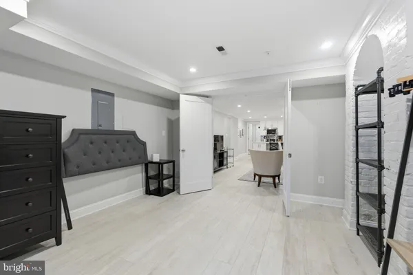 a living room with furniture and a mirror