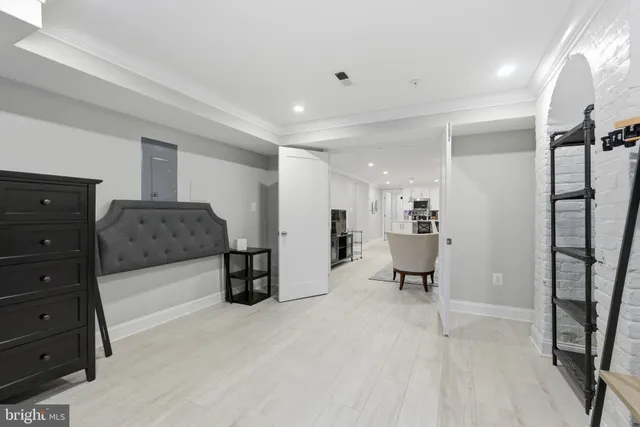 a living room with furniture and a mirror