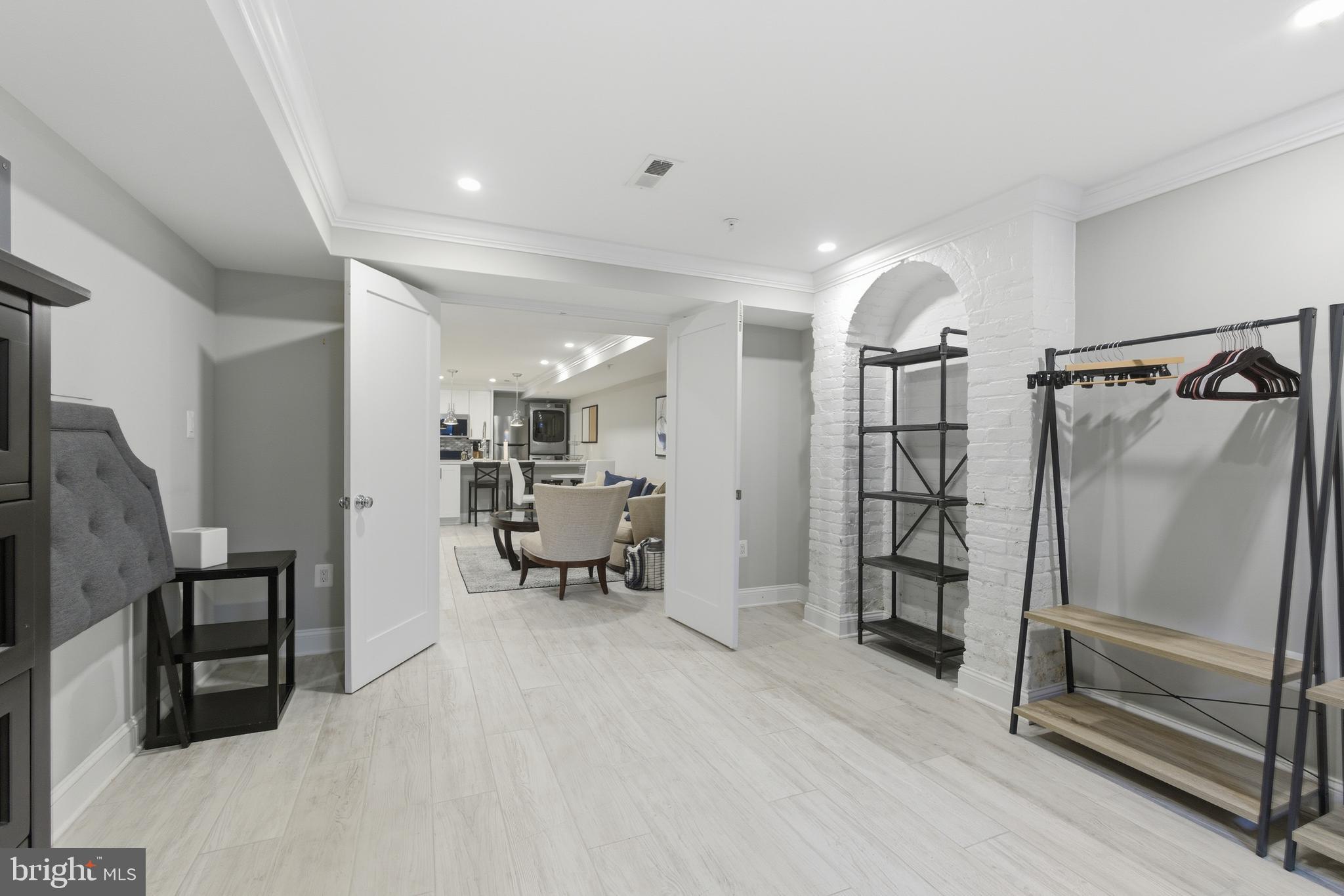 1748 S Street Northwest, Unit 2 Washington, DC 20009 - Photo 8 of 33 a view of a hallway with workspace and furniture
