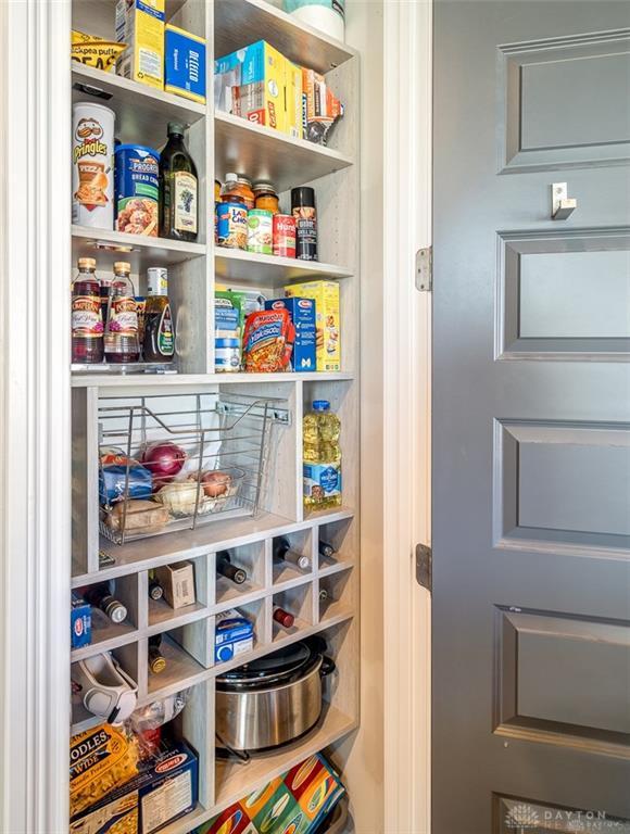 407 Brownstone Row Springboro, OH 45066 - Photo 21 of 54 This pantry features abundant shelving and smart storage solutions, keeping your kitchen organized.