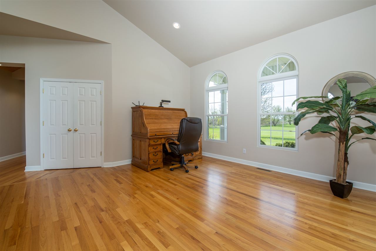6300 Quail Trap Road Poplar Grove, IL 61065 - Photo 11 of 34 a view of workspace with wooden floor windows