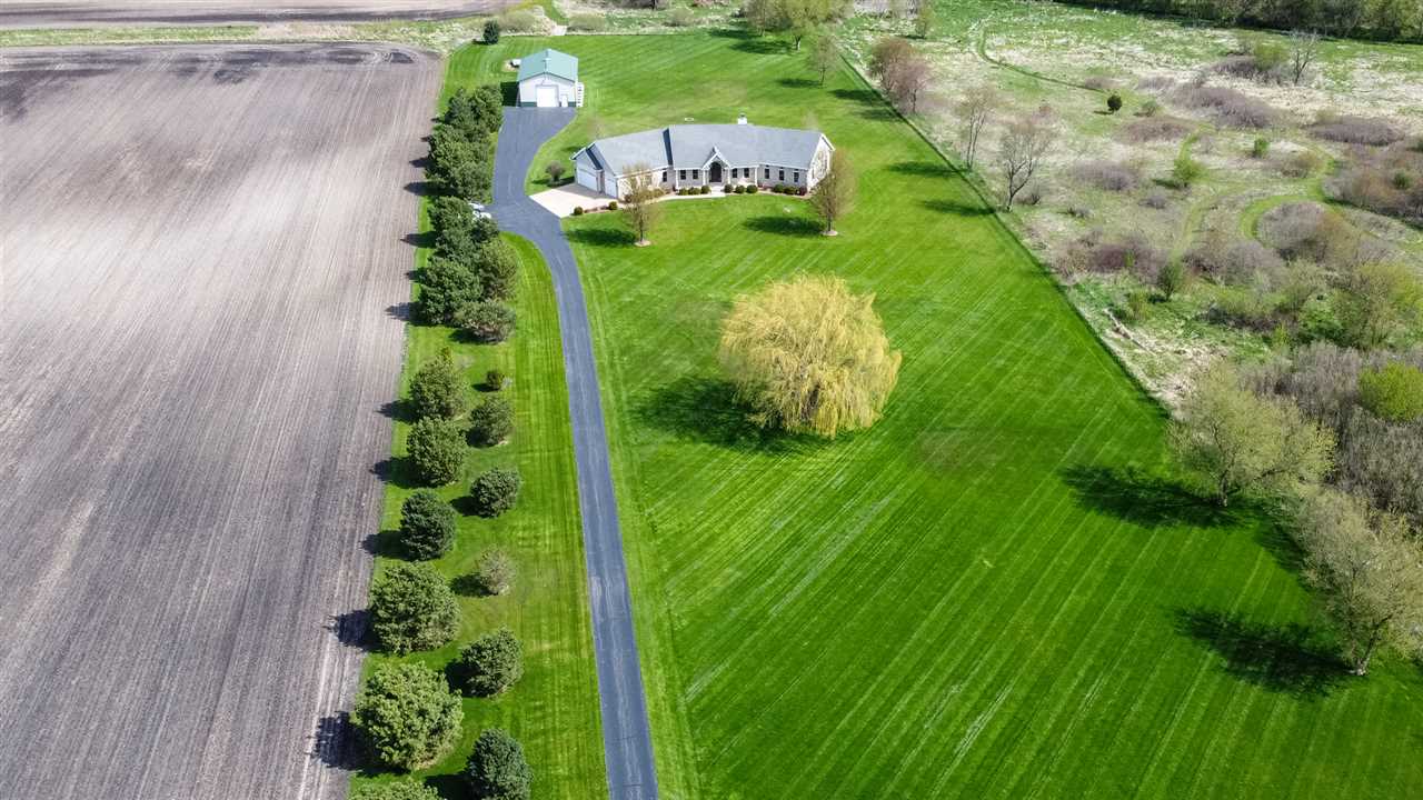 6300 Quail Trap Road Poplar Grove, IL 61065 - Photo 4 of 34 a view of a garden with plants