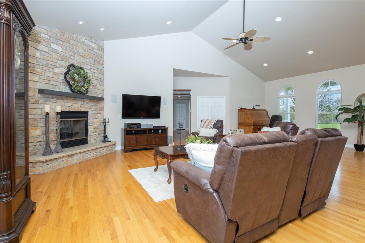 6300 Quail Trap Road Poplar Grove, IL 61065 - Photo 9 of 34 a living room with furniture and a flat screen tv