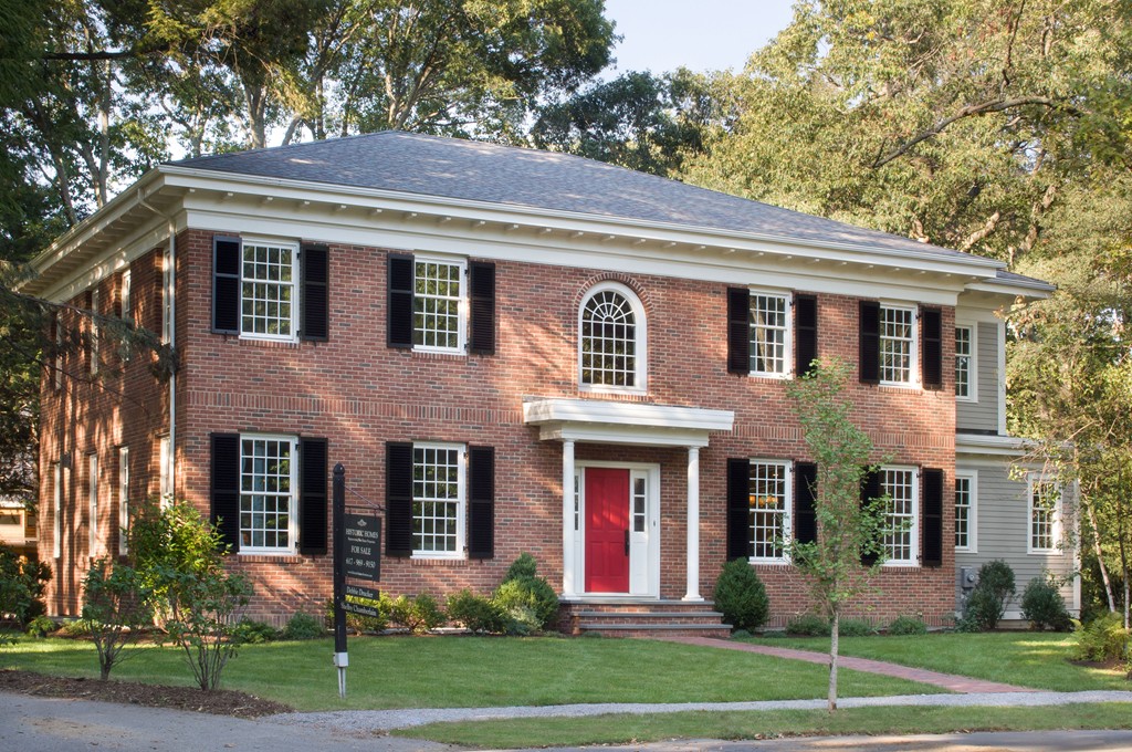 a front view of a house with a yard