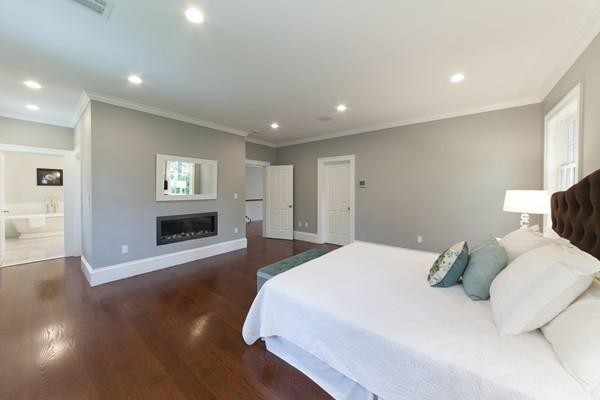 15 Cedar Road Brookline, MA 02467 - Photo 11 of 14 a spacious bedroom with a bed and a couch