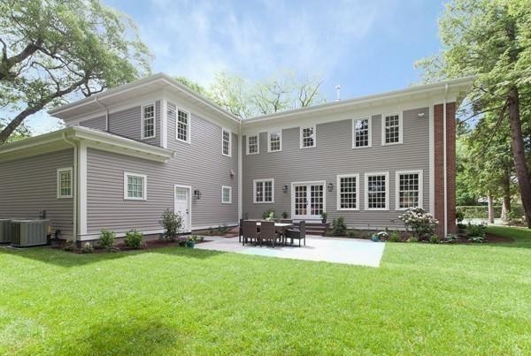 15 Cedar Road Brookline, MA 02467 - Photo 13 of 14 a front view of house with yard outdoor seating and yard