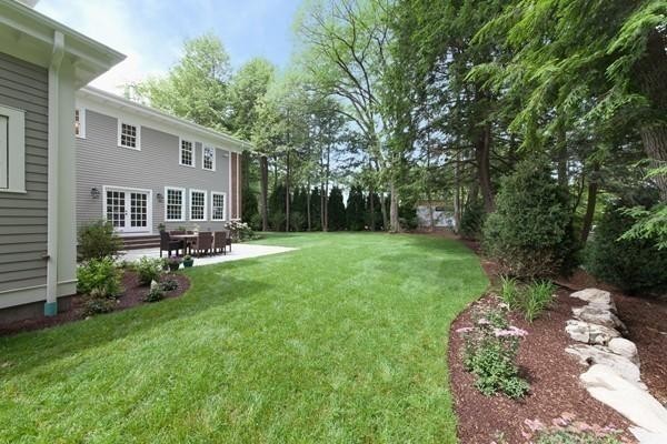 15 Cedar Road Brookline, MA 02467 - Photo 2 of 14 a view of a patio with table and chairs potted plants and large tree