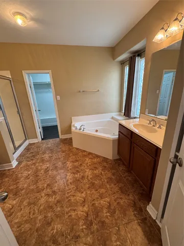 a view of entryway with cabinet and wooden floor