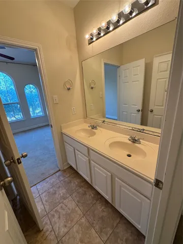 a bathroom with a toilet and a bath tub
