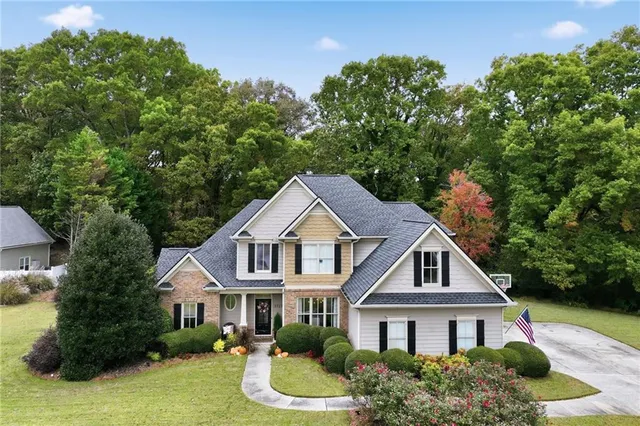 a front view of a house with a yard