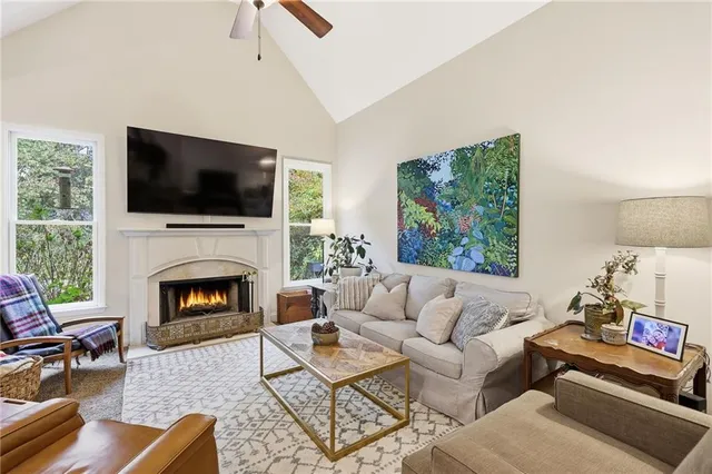 a kitchen with stainless steel appliances granite countertop a sink and a refrigerator
