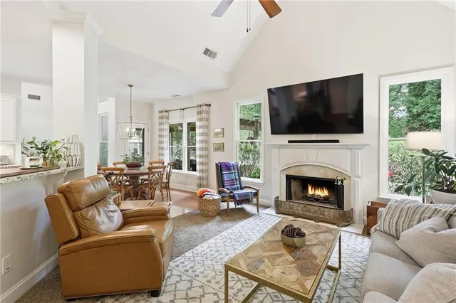 a kitchen with a white stove top oven table and chairs